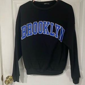 Shein women’s black sweatshirt. Size small